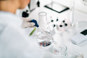 Microplastic particles floating in water.