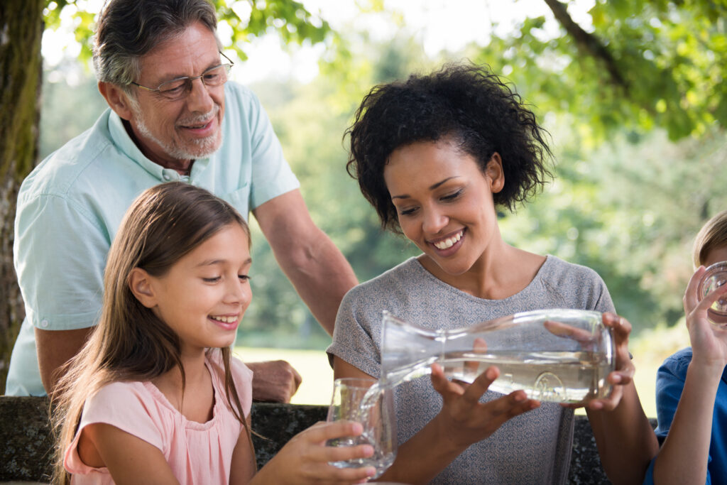 A happy family spending time in a park.